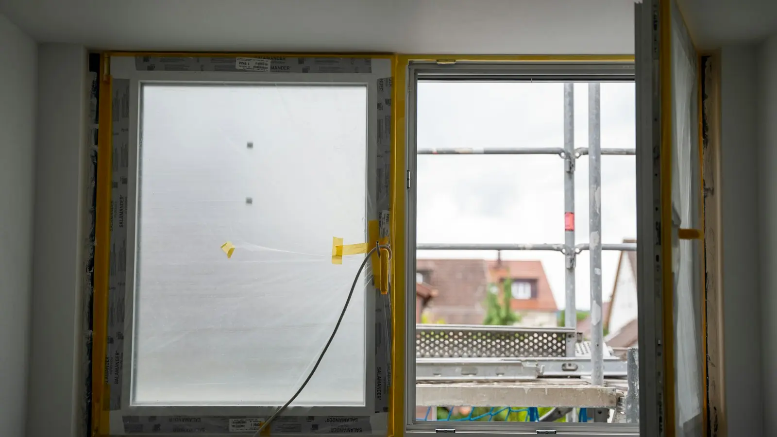Partially installed window in a room under renovation